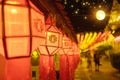 Hundred Thousand Lantern Festival in Lamphun people hang colorful light lanterns at Wat Phra That Hariphunchai Temple