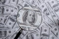 us dollar bill through magnifying lens checking banknotes Royalty Free Stock Photo
