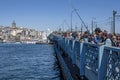 Hundreds of fishermen on Galata Bridge at Istanbul in Turkey. Royalty Free Stock Photo