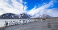 Hundreds of king penguins flee from heavy winds forming over the glacier Royalty Free Stock Photo