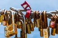 Hundreds of love locks hanging on a chain