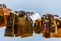 Hundreds of love locks hanging on a chain