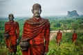 Hundreds of Old Statues of Buddhist Monks Collecting Alms Surround the Win Sein Taw Ya Buddha in Mawlamyine, Myanmar Burma