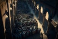 Hundreds of people gathered between ancient pillars, arches for prayer. Ramadan as a time of fasting and prayer for Muslims Royalty Free Stock Photo