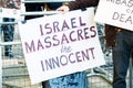 Protest messages on placards and posters at the Gaza: Stop The Massacre rally in Whitehall, London, UK.