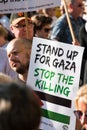 Protest messages on placards and posters at the Gaza: Stop The Massacre rally in Whitehall, London, UK.