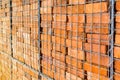 Close up of reclaimed bricks stacked in a metal cage