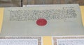 Old manuscript with red seal situated in the Corvins Castle. Royalty Free Stock Photo