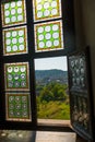 HUNEDOARA, ROMANIA:Open window. View of the beautiful summer landscape, view from the castle Corvin Castle Royalty Free Stock Photo