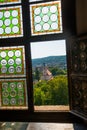 HUNEDOARA, ROMANIA:Open window. View of the beautiful summer landscape, view from the castle Corvin Castle Royalty Free Stock Photo