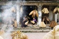 Hung Yen, Vietnam - July 26, 2015: Old women weaves bamboo fish trap at Vietnamese traditional crafts village Thu Sy, Hung Yen pro