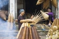 Hung Yen, Vietnam - July 26, 2015: Old women weaves bamboo fish trap at Vietnamese traditional crafts village Thu Sy, Hung Yen pro