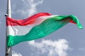 Hungarian flag on blue sky background Royalty Free Stock Photo