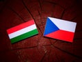 Hungarian flag with Czech flag on a tree stump