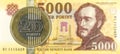 200 hungarian forint coin against 5000 hungarian forint note Royalty Free Stock Photo