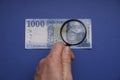 1000 Hungarian forints cash Portrait of King MÃÂ¡tyÃÂ¡s. Examine through the magnifying glass.