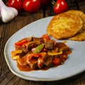 Hungarian goulash with potato pancakes Royalty Free Stock Photo