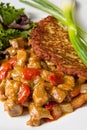 Hungarian goulash with potato pancakes Royalty Free Stock Photo