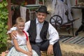 Hungarian grandfather and granddaughter from Banat, in tradition