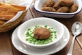 Hungarian green peas stew and fried meatball