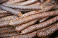 Hungarian homemade smoked sausages with red paprika at rural mar