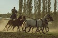 Hungarian horseman ride five horses. He wears the traditional Hungarian national costume for the horse show, SALFÃâLD, HUNGARY -