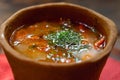 Hungarian national dish - bogracs in bread plate. Soft focus