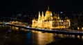 Hungarian Parliament in Budapest by Danube river at night Royalty Free Stock Photo