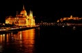 The Hungarian Parliament in Budapest and the Royal castle at the opposite side at night Royalty Free Stock Photo