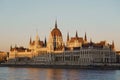 Hungarian parliament building in Budapest with river Danube - sunset golden hour Royalty Free Stock Photo