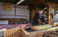 Hungarian sweet delicacy trdelnik that roast over coals is prepared on the spits at street bakery