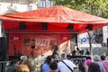 Hungarians and foreign travelers watching and listening music concert show in street fair carnival at Andrassy Avenue road on