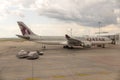 QATAR Airline Airplane getting ready for takeoff at Budapest airport, passengers loading