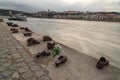 memorail monument - Old metal rusty shoes on parapet of Danube river bank embankment. Monument to the victims of Nazi repression