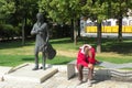 Hungary, Budapest, Muegyetem rakpart, statue of Tamas Cseh and a tired young man