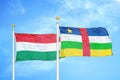 Hungary and Central African Republic two flags on flagpoles and blue cloudy sky