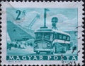 Hungary circa 1963: A post stamp printed in Hungary showing a bus with transmitters. Mobile Radio Transmitter and Stadium