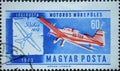 Hungary circa 1962: A post stamp printed in Hungary showing a historic airplane: Light monoplane and 1912 aerobatic plane