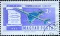 Hungary circa 1962: A post stamp printed in Hungary showing a historic airplane: Supersonic bomber and Zhukovski`s turbomotor Royalty Free Stock Photo