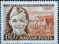 Hungary circa 1950: A post stamp printed in Hungary showing a Pioneer with tent camp during the International Children`s Day