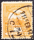 Hungary, circa 1900-94 A postage stamp printed in Hungary depicts the mythical bird Turul flying over the crown of St