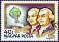 HUNGARY - CIRCA 1977: A stamp printed in Hungary from the `Airships ` issue shows Montgolfier Brothers and Balloon, circa 1977. Royalty Free Stock Photo