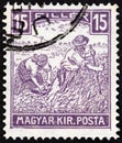HUNGARY - CIRCA 1916: A stamp printed in Hungary shows harvesters, circa 1916.