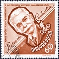 A stamp printed in Hungary shows a portrait image of Pierre de Coubertin