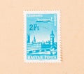 A stamp printed in Hungary shows an airplane over the city of London, circa 1970