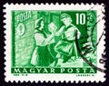 HUNGARY - CIRCA 1964: A stamp printed in Hungary shows Girl pioneer and woman letter carrier, circa 1964.