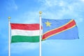 Hungary and Congo Democratic Republic two flags on flagpoles and blue cloudy sky