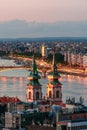 Hungary, evening twilight in Budapest, church on the background of night city lights, cityscape Royalty Free Stock Photo