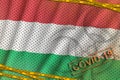 Hungary flag and Covid-19 biohazard symbol with quarantine orange tape and stamp. Coronavirus or 2019-nCov virus concept