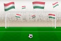 Hungary football team fans with flags of Hungary cheering on stadium, penalty kick concept in a soccer match Royalty Free Stock Photo